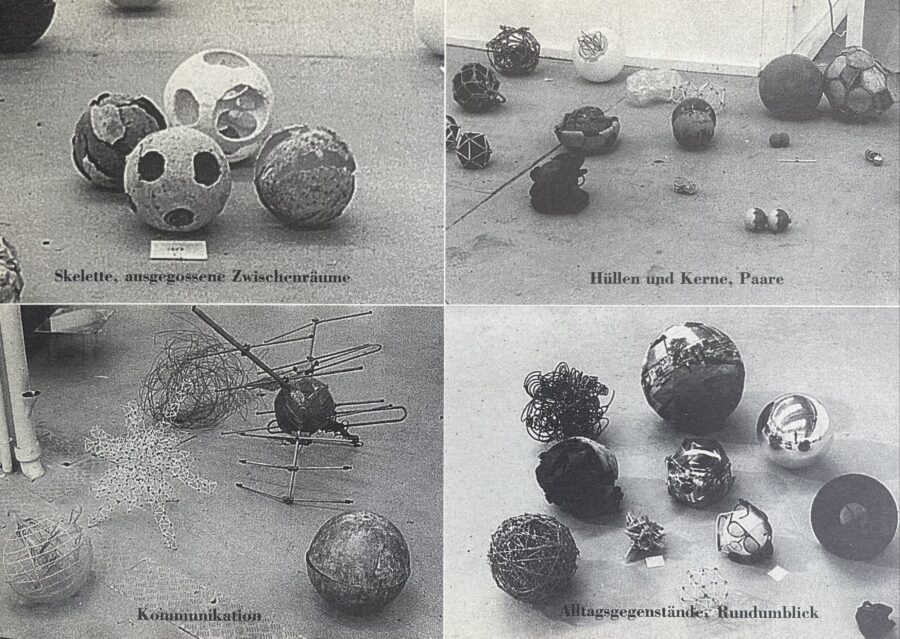 Das Bild zeigt vier Schwarz-Weiss-Fotografien. Auf den vier Fotografien sind jeweils verschiedene ballähnliche Skulpturen zu sehen.